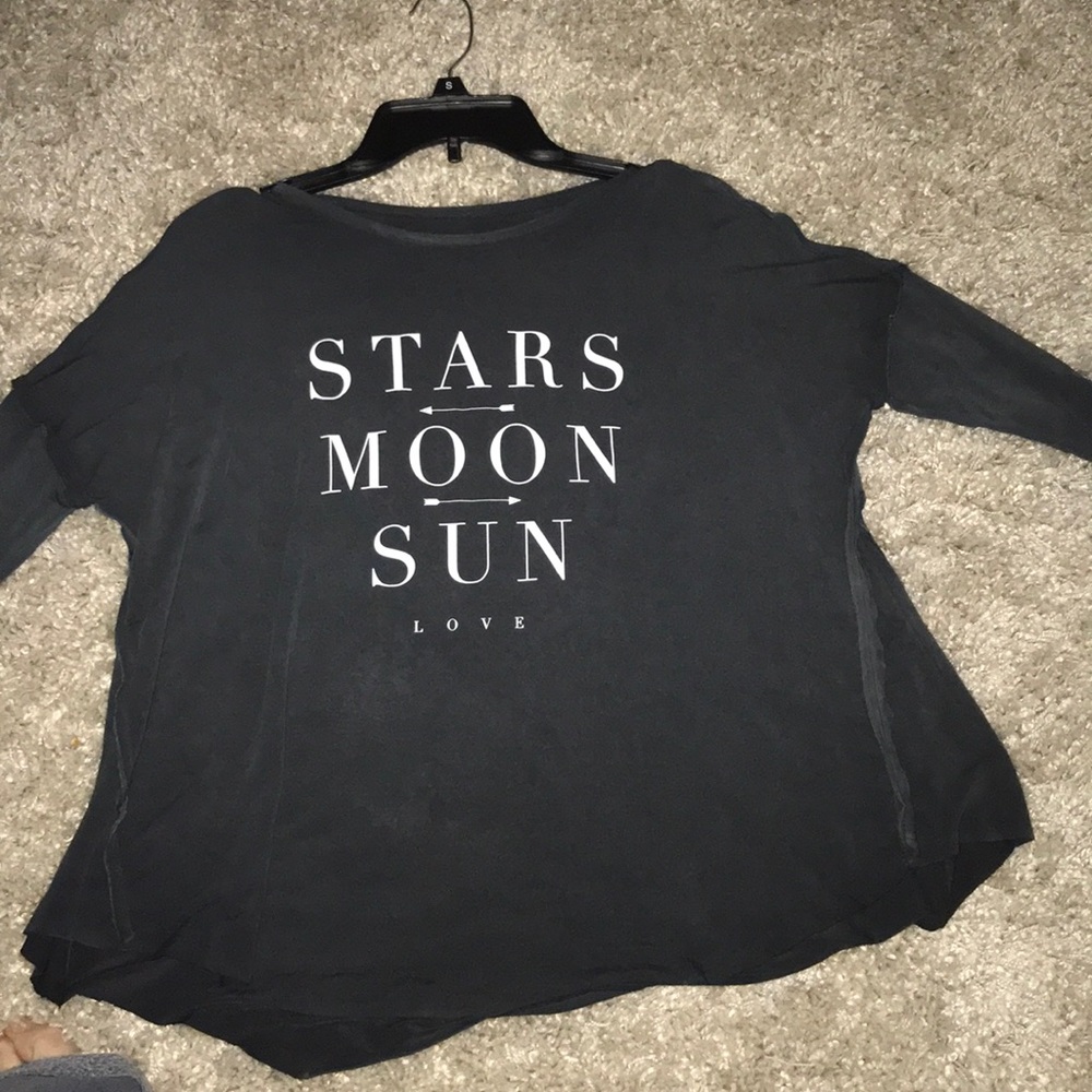 Loose fitting three quarter length shirt.